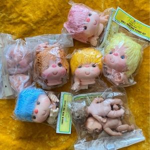 Lot 8 bags of baby doll craft heads